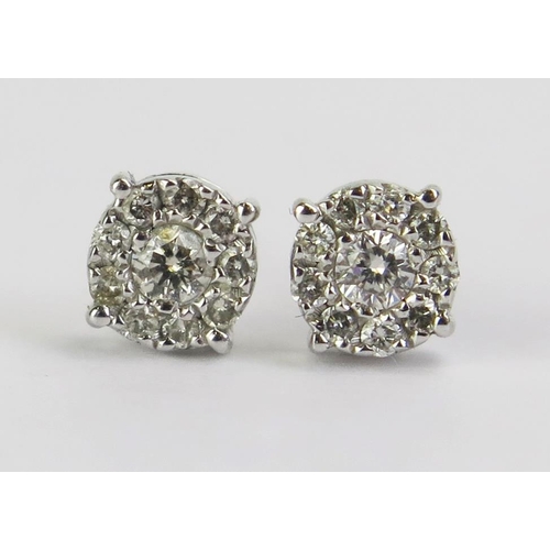 72 - A Pair of 18ct White Gold and Diamond Cluster Stud Earrings, 0.79g gross