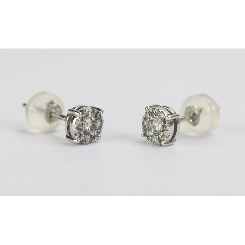 72 - A Pair of 18ct White Gold and Diamond Cluster Stud Earrings, 0.79g gross