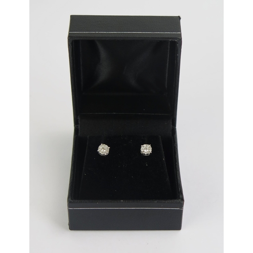 72 - A Pair of 18ct White Gold and Diamond Cluster Stud Earrings, 0.79g gross