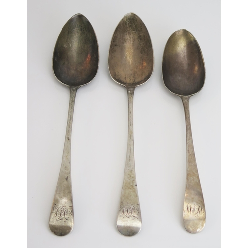 731 - Three assorted George III silver Old English pattern table spoons, various makers and dates, monogra... 