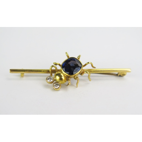 74 - A Diamond and Blue Stone Bug Brooch in a indistinctly marked precious yellow metal setting, KEE test... 