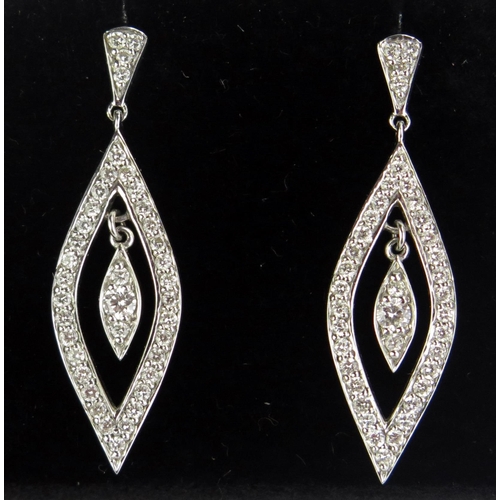 75 - A Pair of 18ct White Gold and Diamond Pendant Earrings, stamped marks, 34mm drop5.49g gross, boxed