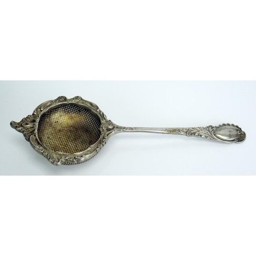 752 - An Edward VII silver strainer, maker Roberts & Belk, Sheffield, 1904, with foliate decoration, cased... 