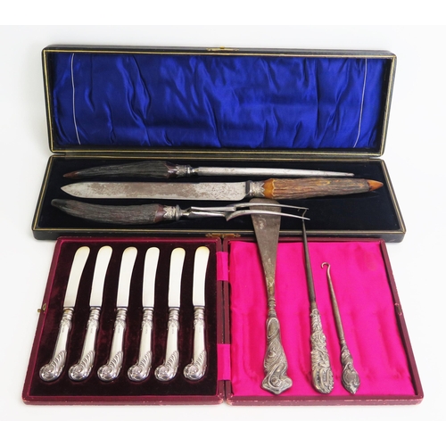 754 - A set of six silver pistol handled butter knives, cased, and antler handled carving set cased, butto... 