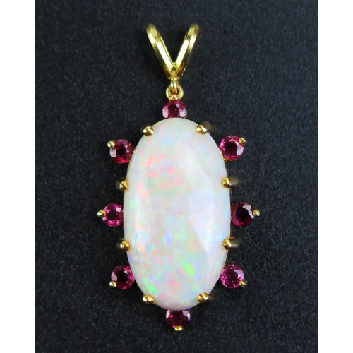 83 - An 18ct Gold, Opal and Ruby Pendant, 24x13mm principal singlet stone, 3mm rubies, 39mm overall drop,... 