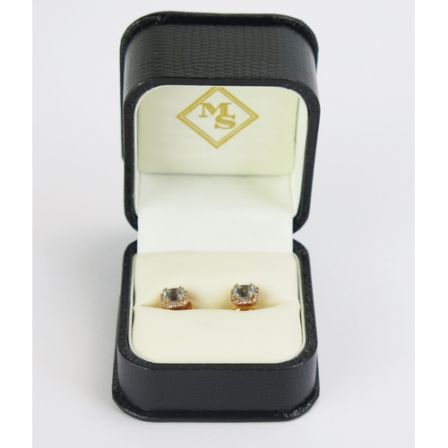 91 - A Pair of William & Son 18ct Gold, Blue Stone & Diamond Stud Earrings, 7.5mm head, hallmarked, 3.22g... 