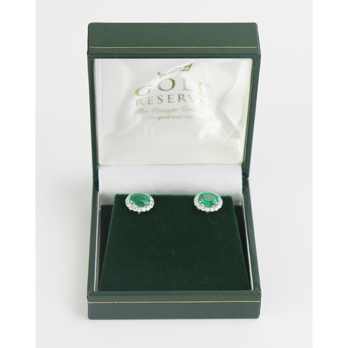 93 - A Pair of 18ct White Gold, Emerald & Diamond Cluster Stud Earrings, stamped 18K, 11.5x10mm heads, 4.... 