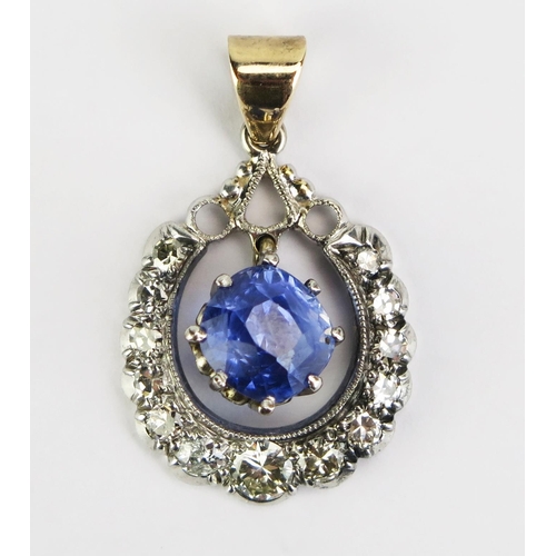 97 - A Sapphire and Diamond Pendant in a precious white and yellow metal setting, 8mm principal stone, 29... 