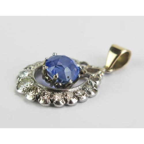 97 - A Sapphire and Diamond Pendant in a precious white and yellow metal setting, 8mm principal stone, 29... 