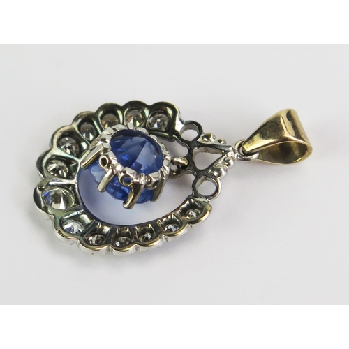 97 - A Sapphire and Diamond Pendant in a precious white and yellow metal setting, 8mm principal stone, 29... 