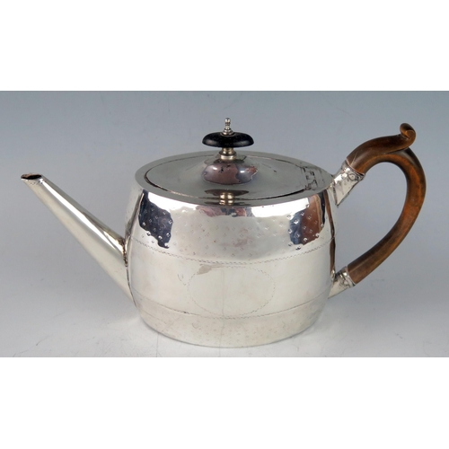 515 - A George III silver oval teapot, maker's mark worn. London, 1788, with banded stellar decoration, 25... 