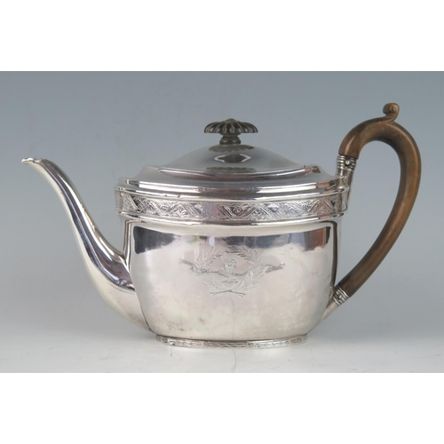 516 - A George III silver oval teapot, maker John Emes, London, 1801, crested, with banded floral decorati... 