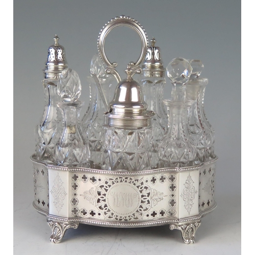 520 - A Victorian silver oval cruet stand, maker John, Edward, Walter & John Barnard, London, 1871, monogr... 