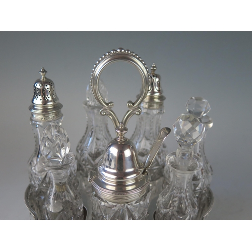 520 - A Victorian silver oval cruet stand, maker John, Edward, Walter & John Barnard, London, 1871, monogr... 