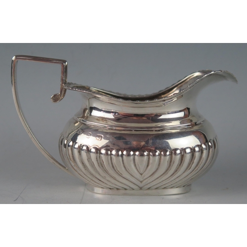 541 - A Victorian silver barge-shaped cream jug, maker's mark worn, Birmingham, 1895, with gadrooned rim, ... 