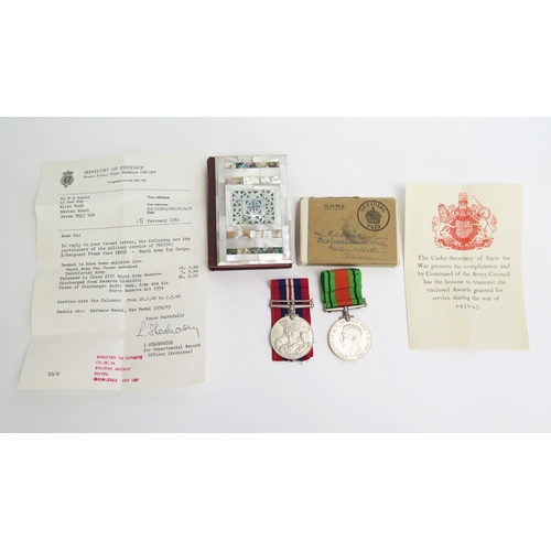 1363 - A pair of World War II medals, War and Defence Medals in original box of issue together with a mothe... 