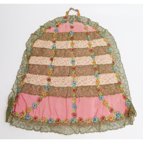 1482 - A Victorian pink silk and embroidered tea cosy, with banded lace and bullion lace decoration, 40cm t... 