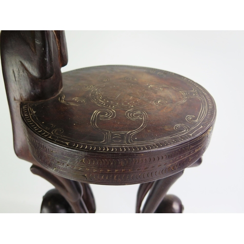 1664 - A Massim stool, Trobriand Islands, Papua New Guinea
with a carved circular top on crouching figural ... 