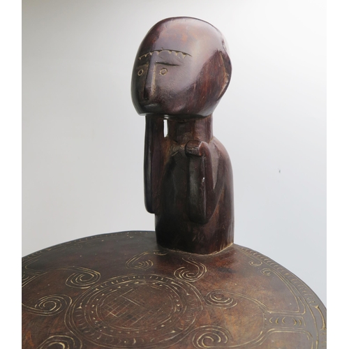 1664 - A Massim stool, Trobriand Islands, Papua New Guinea
with a carved circular top on crouching figural ... 