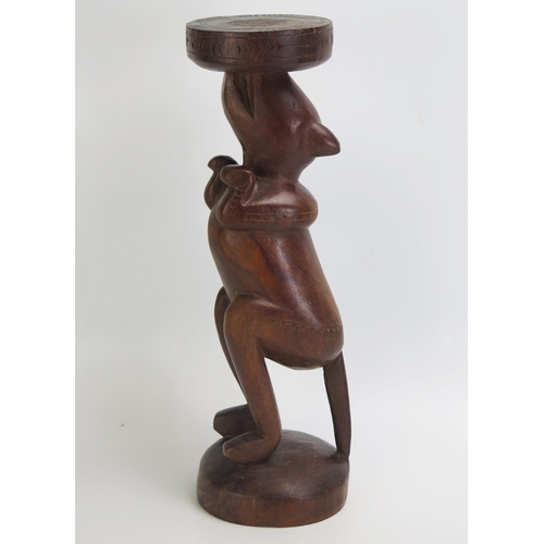 1665 - A Massim stool, Trobriand Islands, Papua New Guinea
with a carved circular top on a single standing ... 