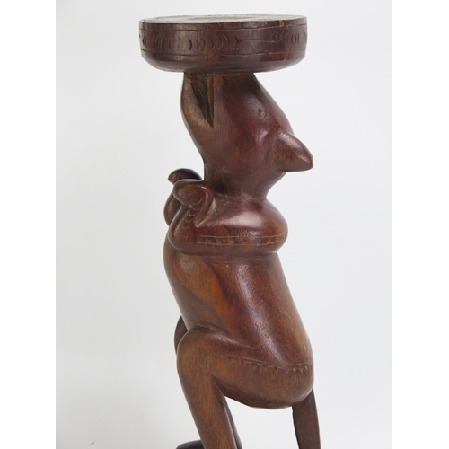 1665 - A Massim stool, Trobriand Islands, Papua New Guinea
with a carved circular top on a single standing ... 