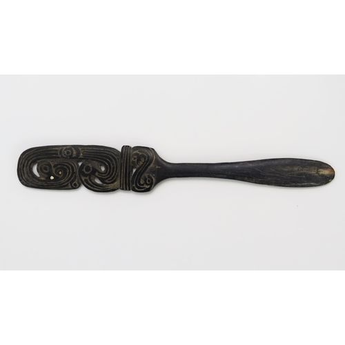 1669 - A Massim lime spatula, Trobriand Islands, Papua New Guinea, the blade17.5cm long.30 with pierced bir... 