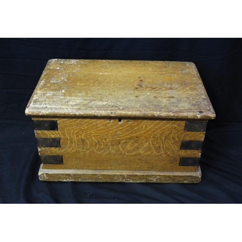 1678 - A simulated oak and metal bound rectangular chest with hinged lid and loop carrying handles to the s... 