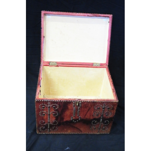 1680 - A red leather bound trunk, with metal stud decoration, having a hinged rectangular top, 51cm wide.