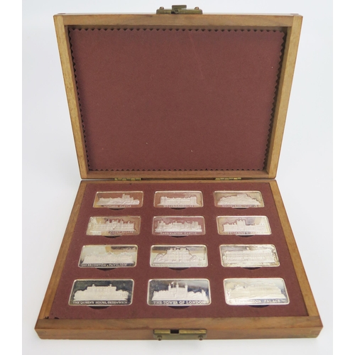 725 - A set of twelve Elizabeth II silver limited edition ingots, 'Royal Palaces', contained in a wood pre... 