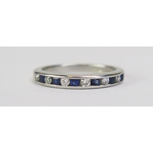 100 - An 18ct White Gold, Sapphire and Diamond Half Eternity Ring, channel set with c. 2.12mm brilliant cu... 