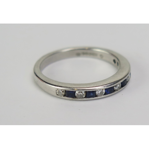 100 - An 18ct White Gold, Sapphire and Diamond Half Eternity Ring, channel set with c. 2.12mm brilliant cu... 