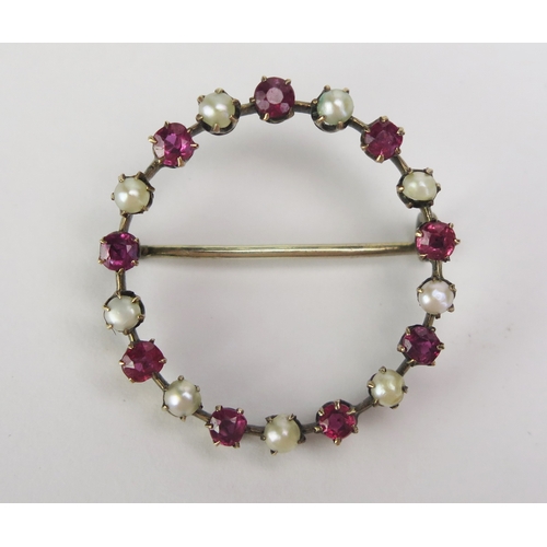 101 - A Ruby and untested Pearl Halo Brooch in a precious yellow metal setting, 28.3mm diam., KEE tested a... 