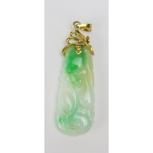 102 - A Carved Jade Pendant in a precious yellow metal mount, stamped 850, 51.8mm drop, 6.33g