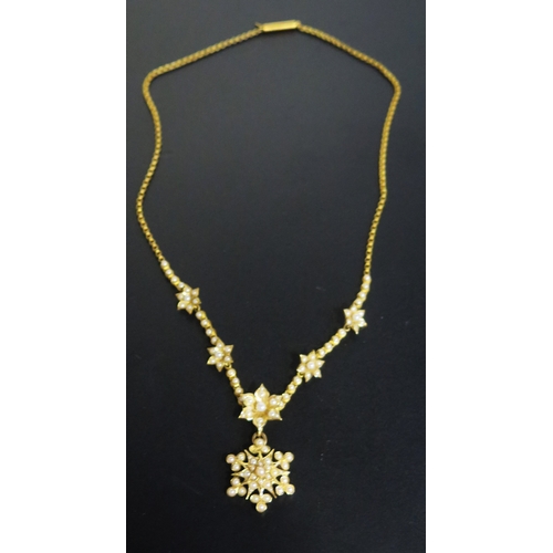 113 - A Victorian 15ct Gold and untested Pearl Necklace with detachable brooch back suspension on an integ... 