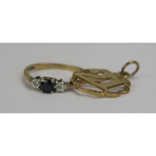 117 - A 9ct Gold 21st Birthday Charm (hallmarked, 1.51g) and a 9ct gold, sapphire and diamond three stone ... 