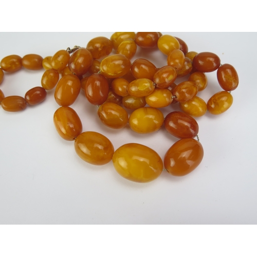 123 - A Butterscotch Amber Graduated Bead Necklace, 35