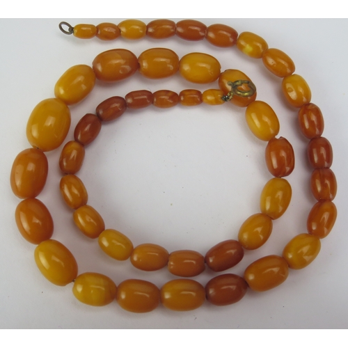 126 - A Butterscotch Amber Bead Necklace, 18