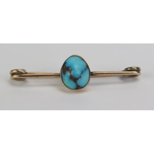 131 - A Precious Yellow metal and Turquoise Brooch in a Johnson, Walker & Tolhurst fitted box, 39.5mm wide... 