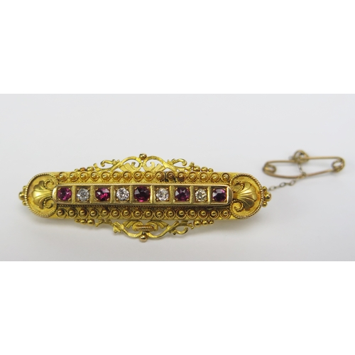 136 - A Victorian 15ct Gold, Ruby and Diamond Brooch set with c. 2.3-2.9mm stones, 48.1mm wide, Chester 18... 