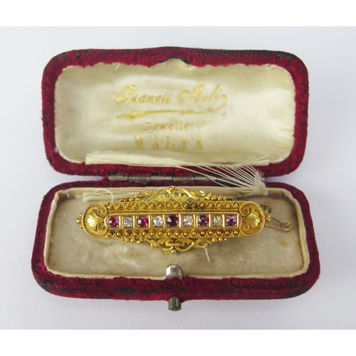 136 - A Victorian 15ct Gold, Ruby and Diamond Brooch set with c. 2.3-2.9mm stones, 48.1mm wide, Chester 18... 