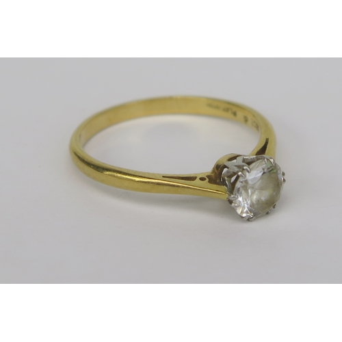 145 - An 18ct Gold, Platinum and White Stone Solitaire Ring, 6mm stone, size Q.5, stamped marks, 2.91g