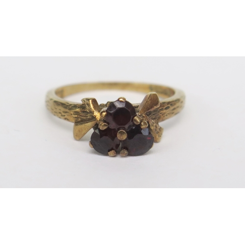 147 - A 9ct Gold and Garnet Three Stone Ring, size M, hallmarked, 3g