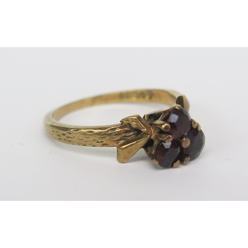 147 - A 9ct Gold and Garnet Three Stone Ring, size M, hallmarked, 3g