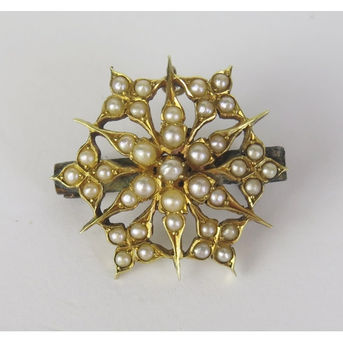 152 - A Victorian untested Pearl Starburst Brooch, with pendant suspension loop, in an unmarked high carat... 