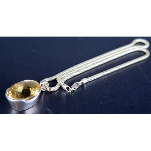 160 - A Sterling Silver and Citrine Pendant on a silver snake link chain, 28.5g