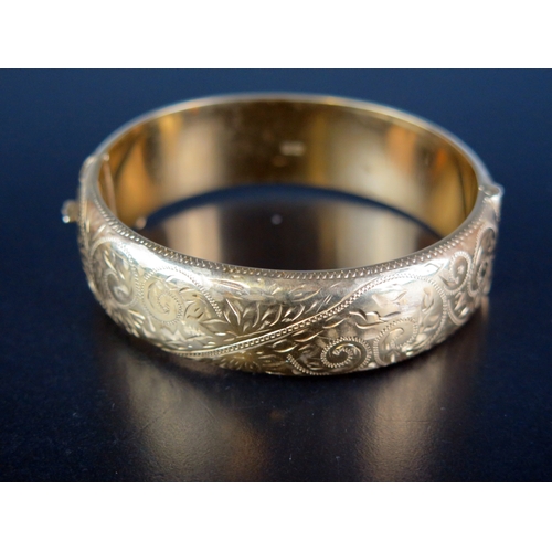 163 - A Silver Gilt Hinged Bangle with chased scrolling decoration, Birmingham 1961,