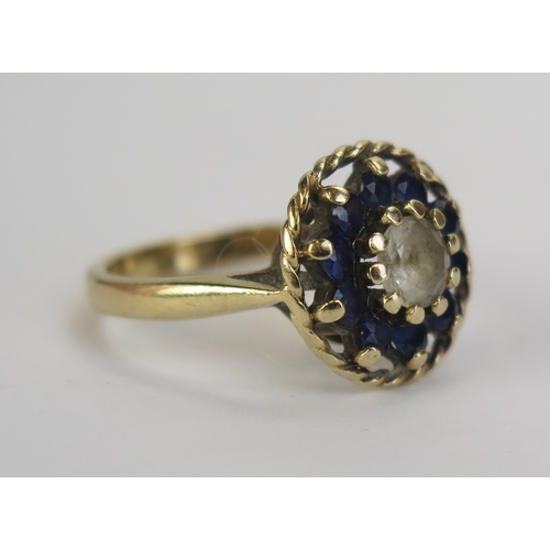 17 - A 9ct Gold and Blue and White Spinel Cluster Ring, 14.1mm diameter head, Birmingham hallmarks, size ... 