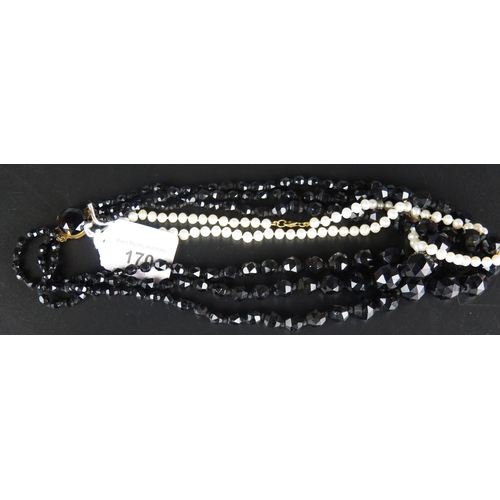 170 - A Faceted Black Glass Three Strand Necklace and an untested pearl necklace