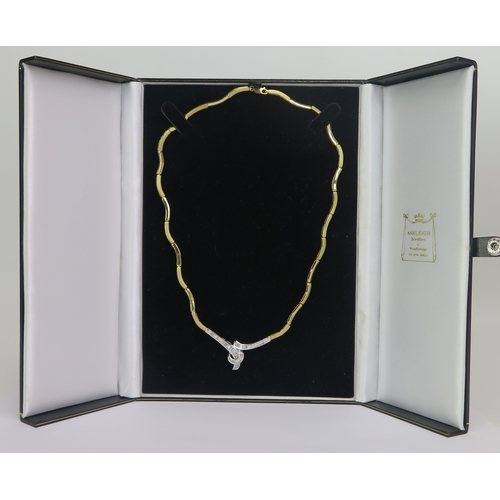 179 - An 18ct Gold and Baguette Cut Diamond Necklace with alternate brushed and polished gold links and a ... 