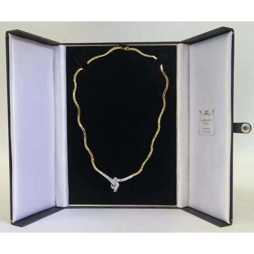 179 - An 18ct Gold and Baguette Cut Diamond Necklace with alternate brushed and polished gold links and a ... 